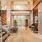 a room with a staircase and chairs