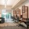 a room with a desk and chairs