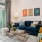 a living room with a blue couch and a coffee table