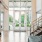 a room with a staircase and a glass door