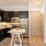 a kitchen with black cabinets